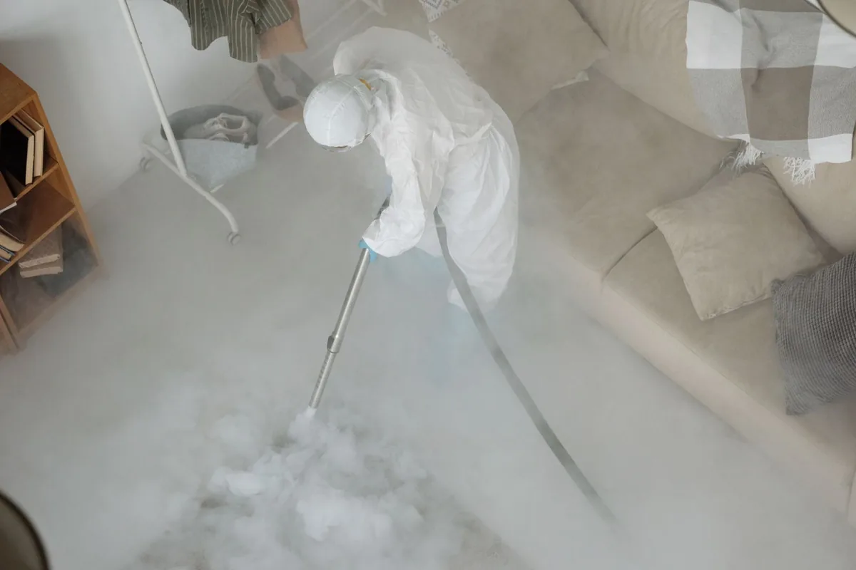 Biohazard cleanup technician in protective equipment, Old Saybrook Center, CT